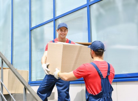 Team member preparing safe moving equipment before a van job