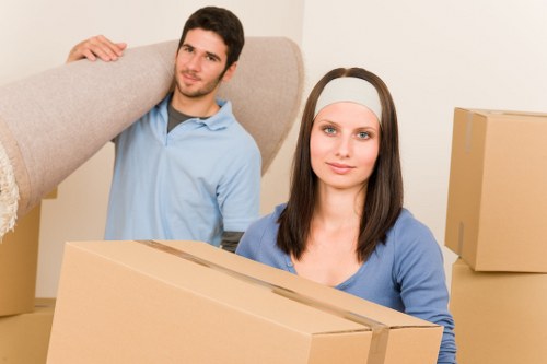 Packed moving boxes and furniture representing example local jobs